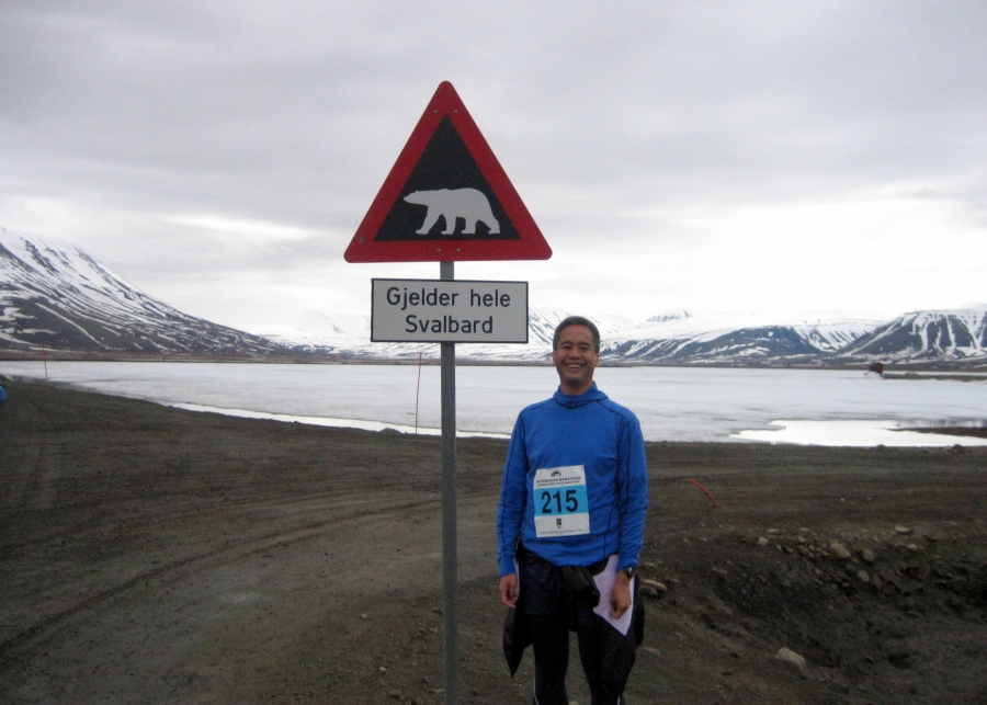 Nick Jesdanun next to a polar bear sign